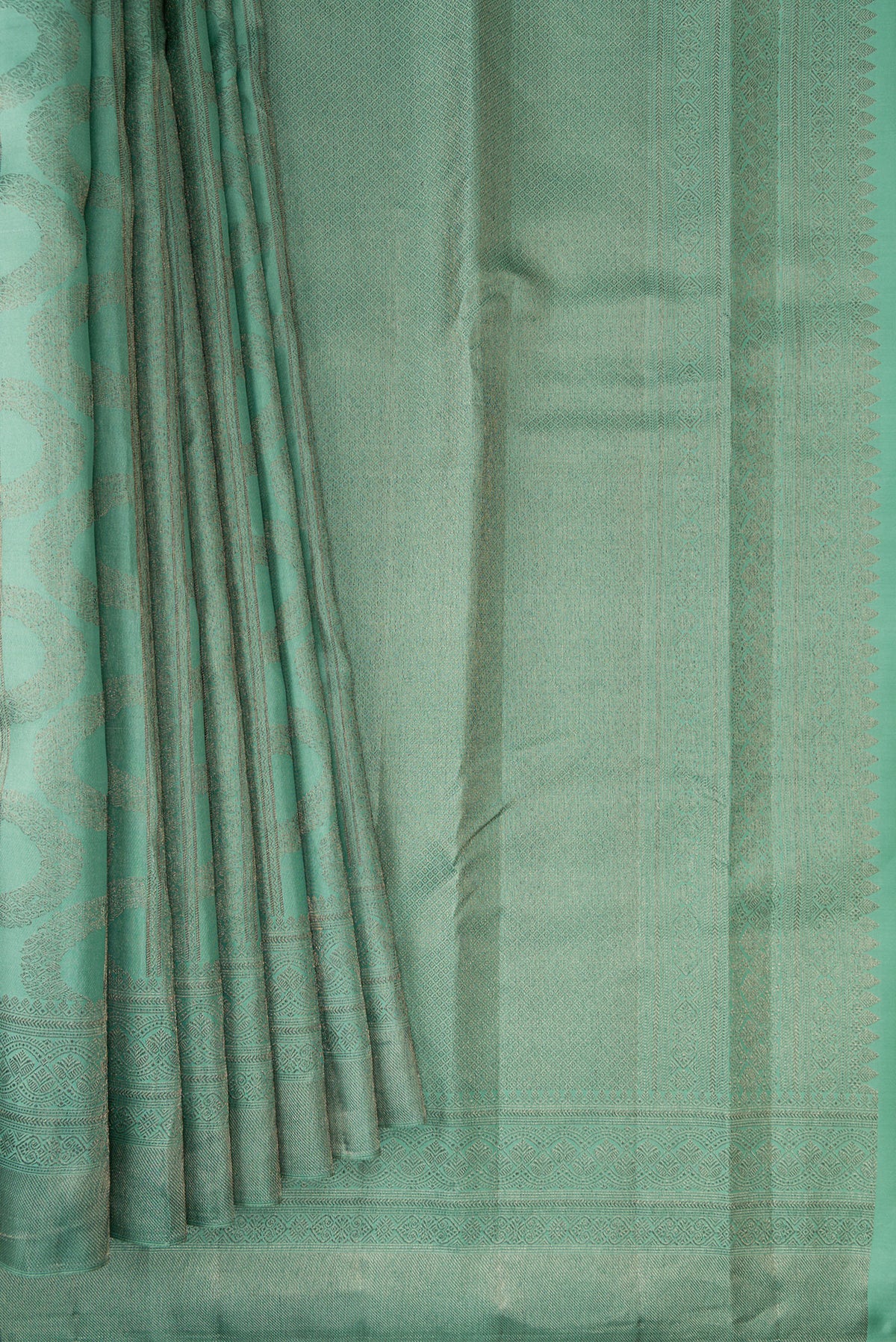 Pleats and pallu of Pure Silk Sea Green Kanjivaram Saree with Zari Brocade on the body and Fancy Border. 