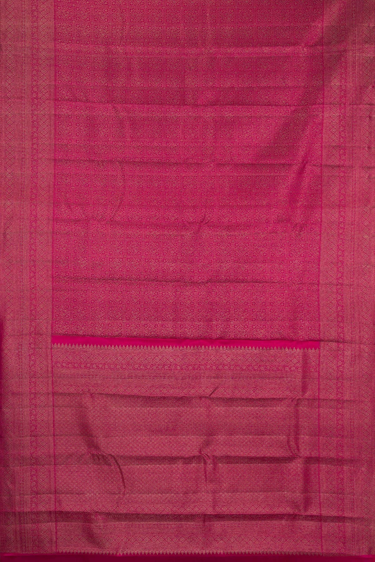 Flat view of Pure Silk Dark Pink Kanjivaram Saree with Zari Brocade on the body and Fancy Border. 