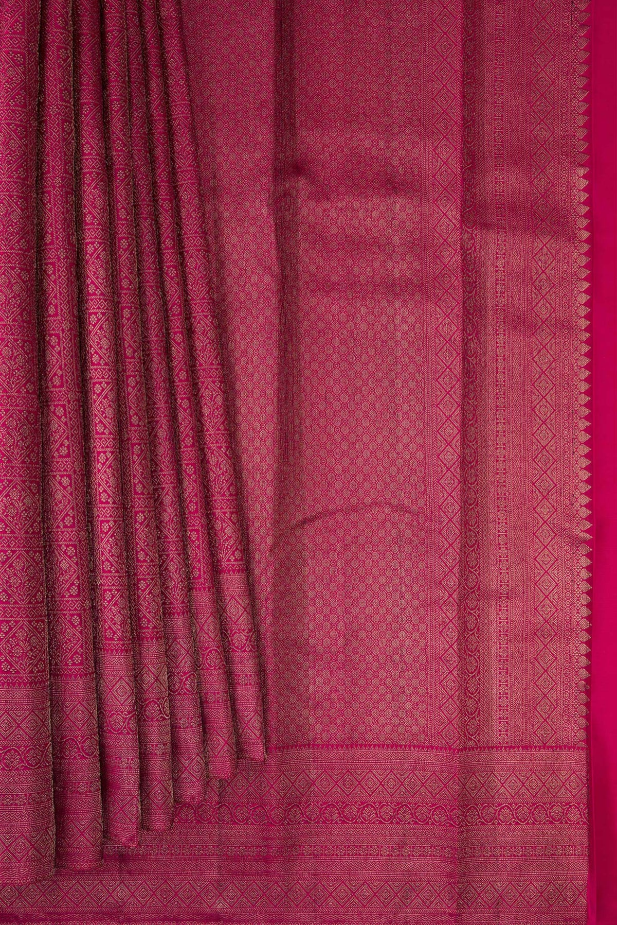 Pleats and pallu of Pure Silk Dark Pink Kanjivaram Saree with Zari Brocade on the body and Fancy Border. 