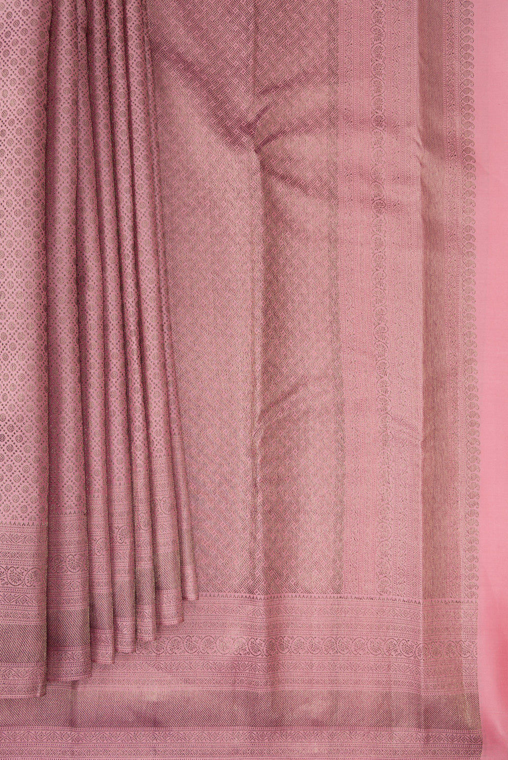 Pleats and pallu of Pure Silk Rose Gold Dual Tone Kanjivaram Saree with Zari Brocade on the body and Fancy Border. 