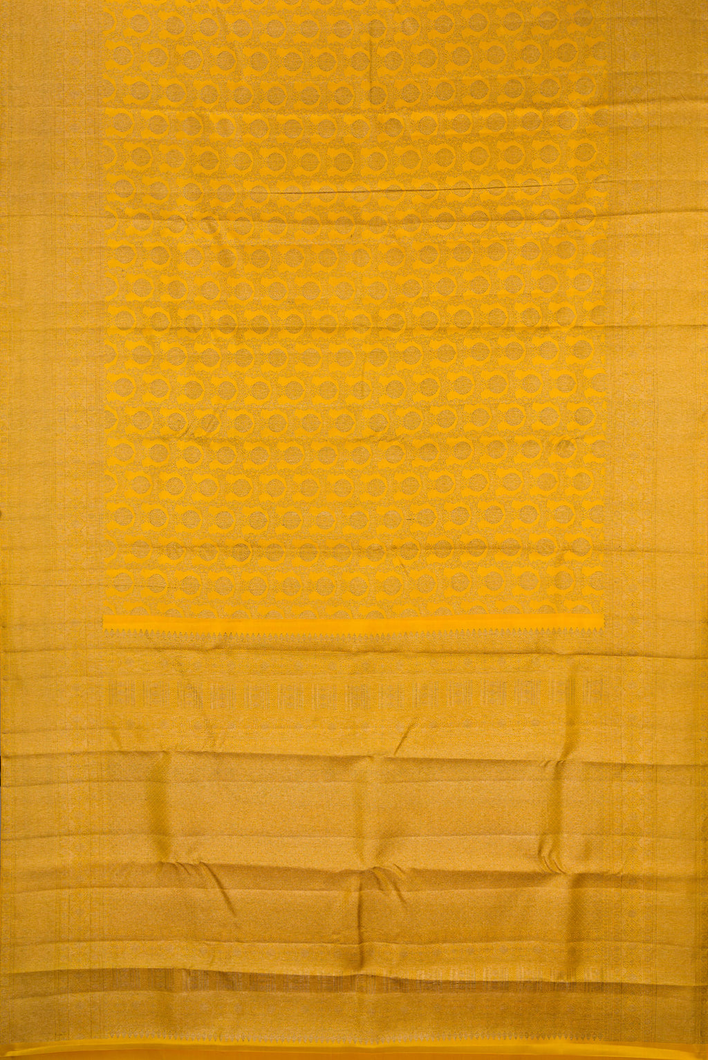 Flat view of Pure Silk Mustard Kanjivaram Saree with Zari Brocade on the body and Zari Border. 