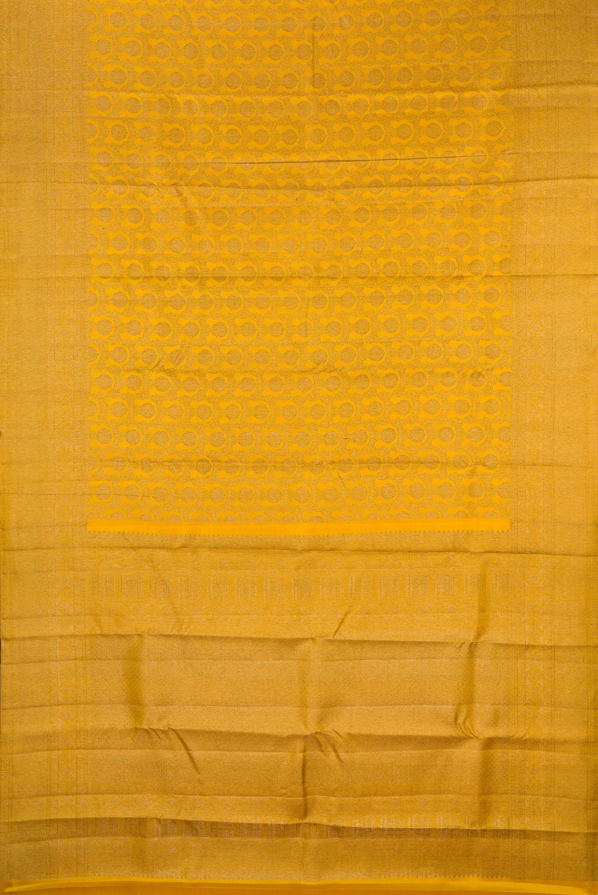 Flat view of Pure Silk Mustard Kanjivaram Saree with Zari Brocade on the body and Zari Border. 