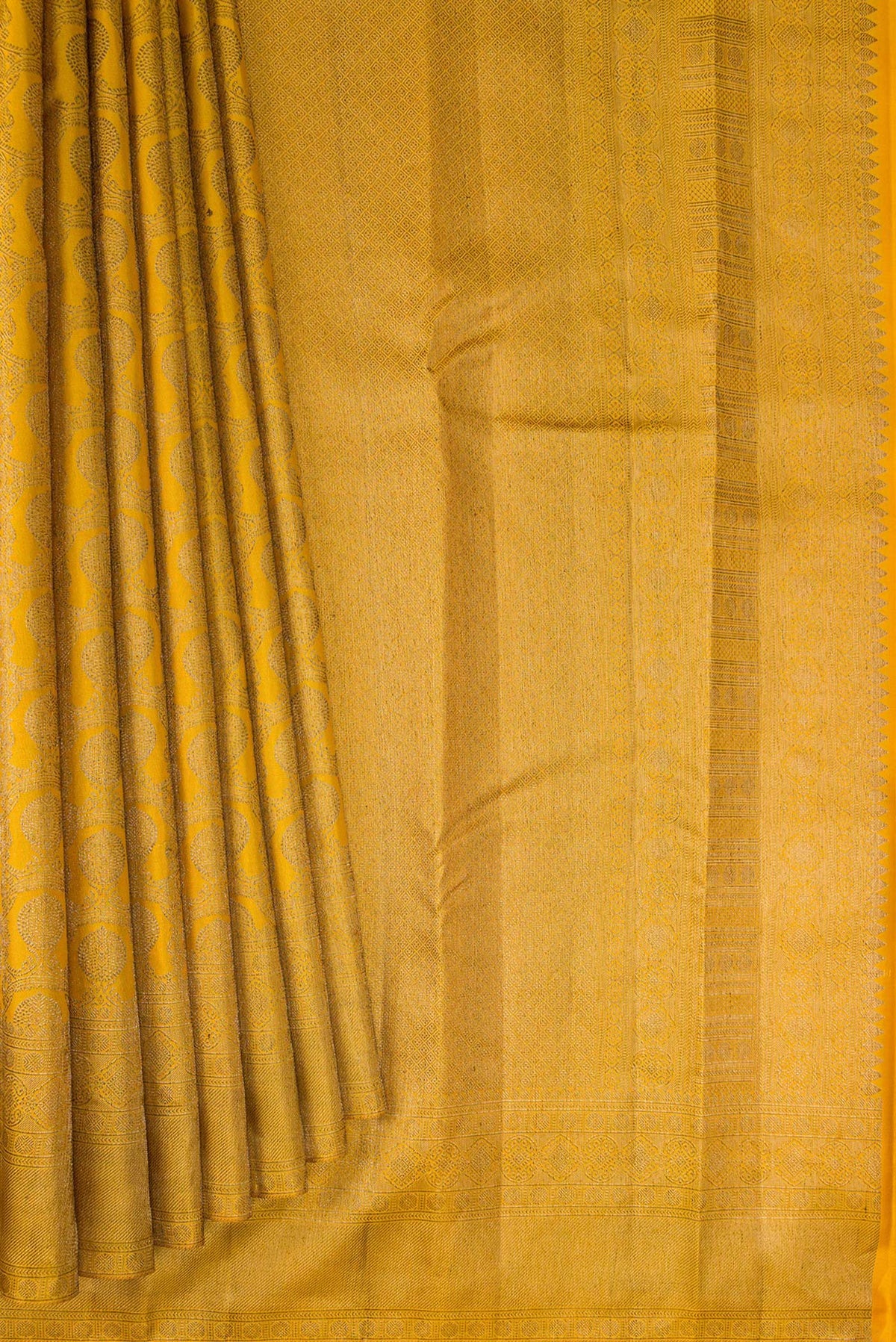 Pleats and pallu of Pure Silk Mustard Kanjivaram Saree with Zari Brocade on the body and Zari Border. 