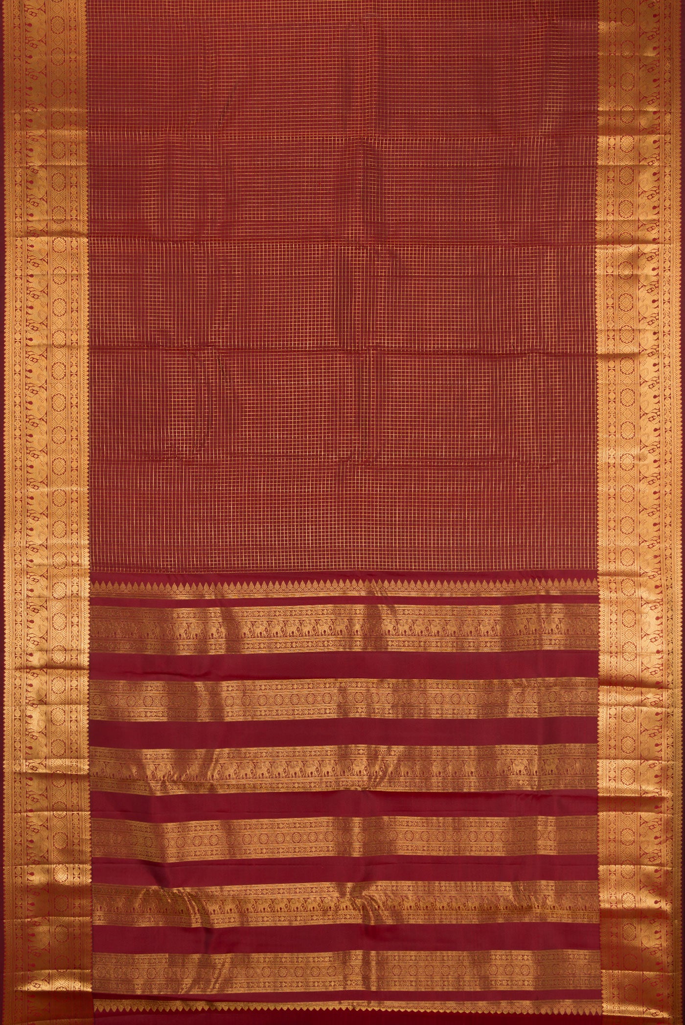Flat view of Maroon Kanjivaram Silk Saree with Checked design on the body and Zari Border. 
