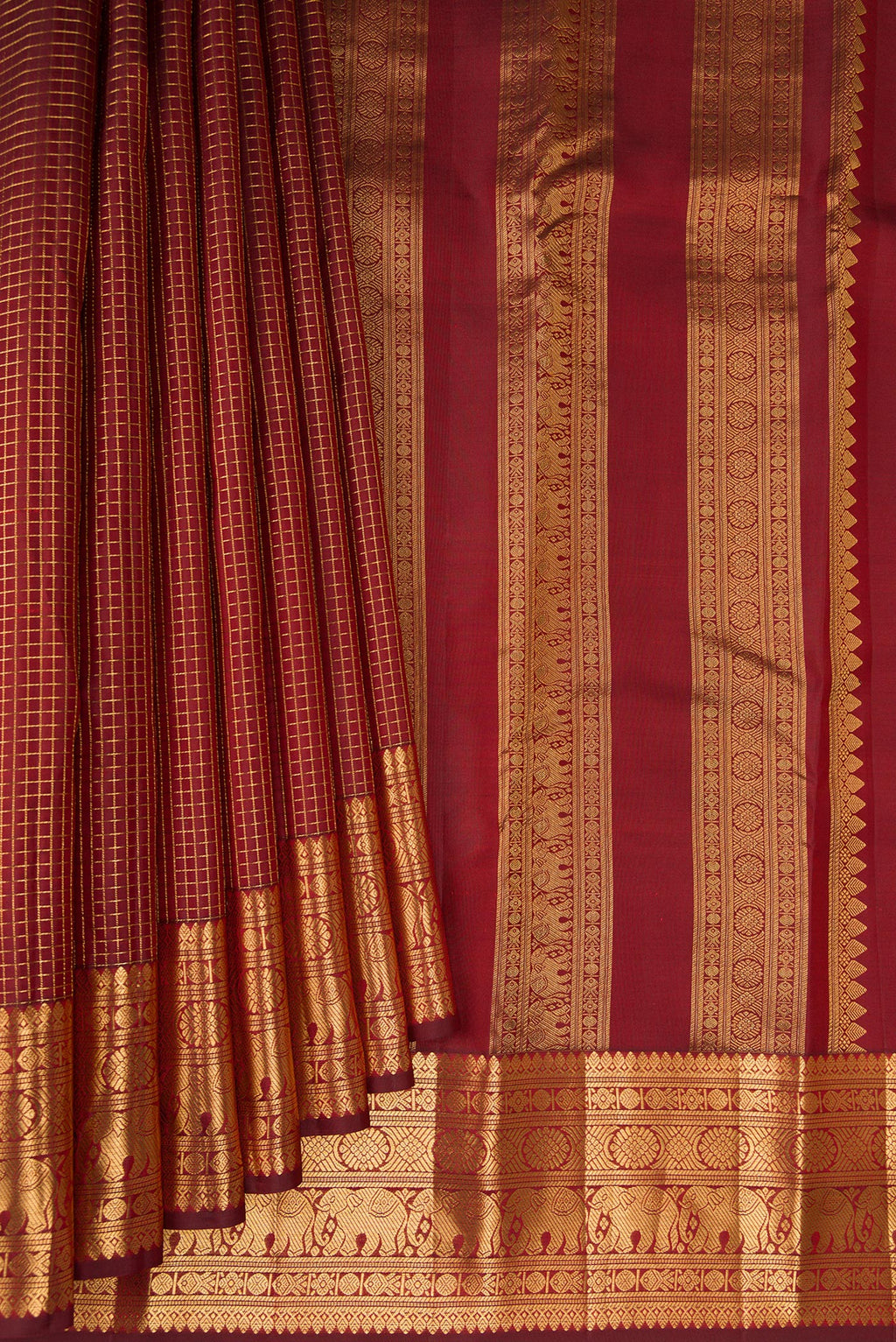 Pleats and pallu of Maroon Kanjivaram Silk Saree with Checked design on the body and Zari Border. 