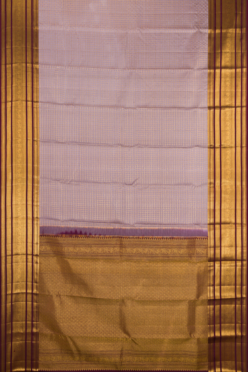 Flat view of Lilac Kanjivaram Silk Saree with Checked design on the body and Zari Border. 