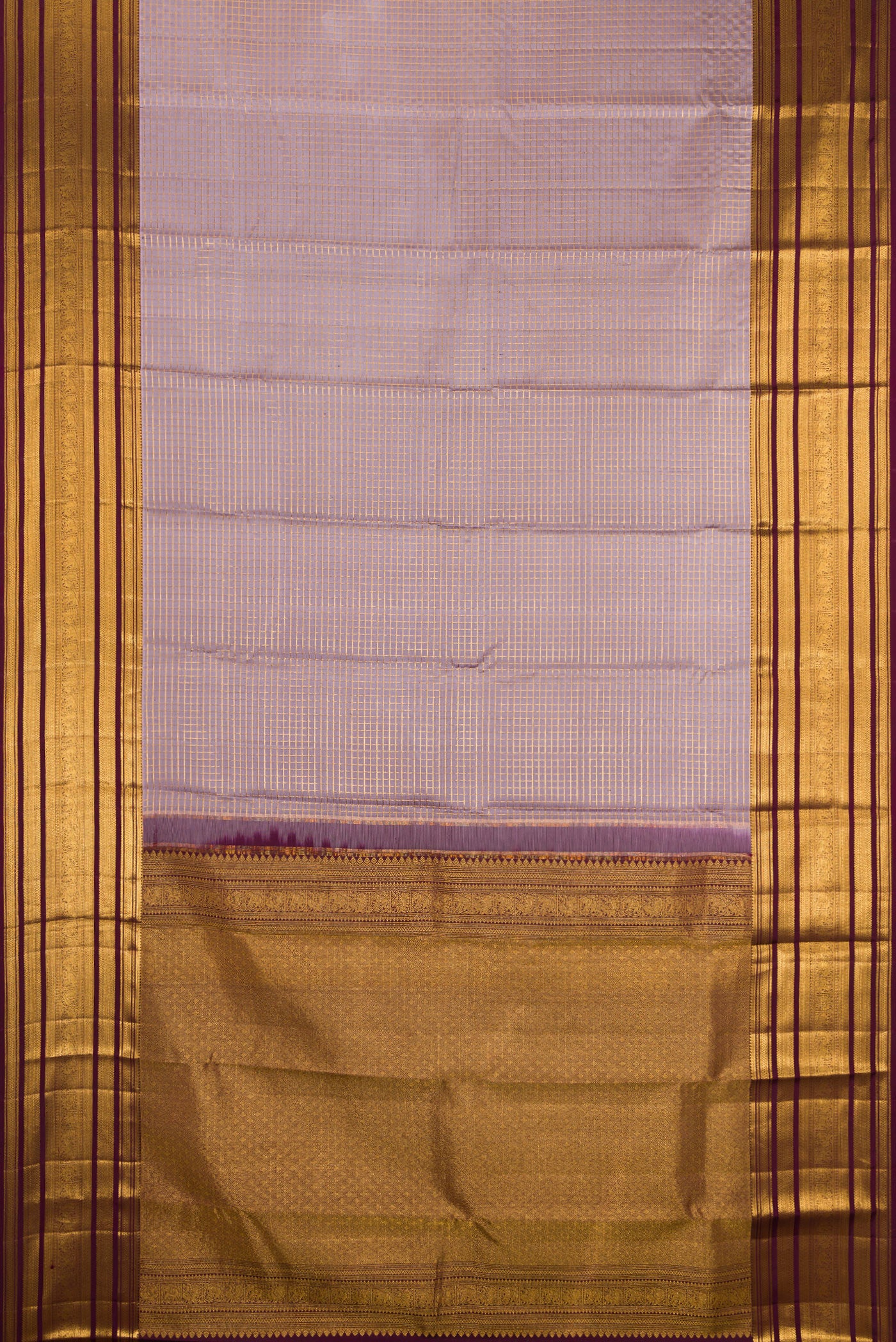 Flat view of Lilac Kanjivaram Silk Saree with Checked design on the body and Zari Border. 