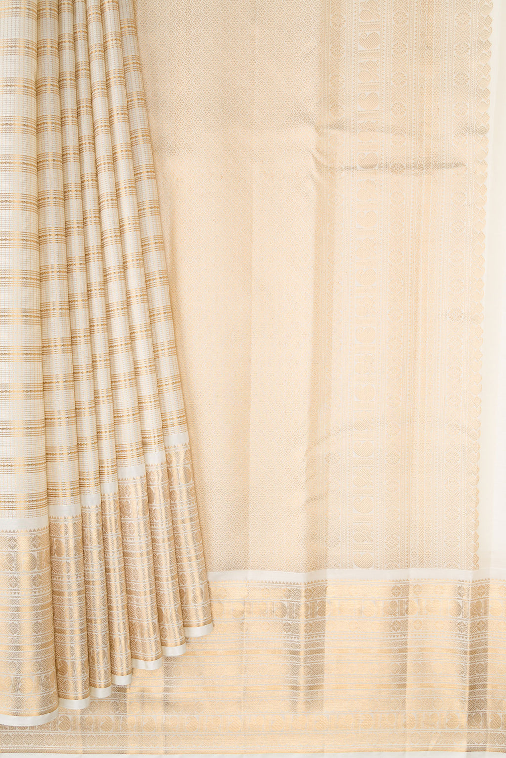Pleats and pallu of Cream Kanjivaram Silk Saree with Stripes on the body and Zari Border. 