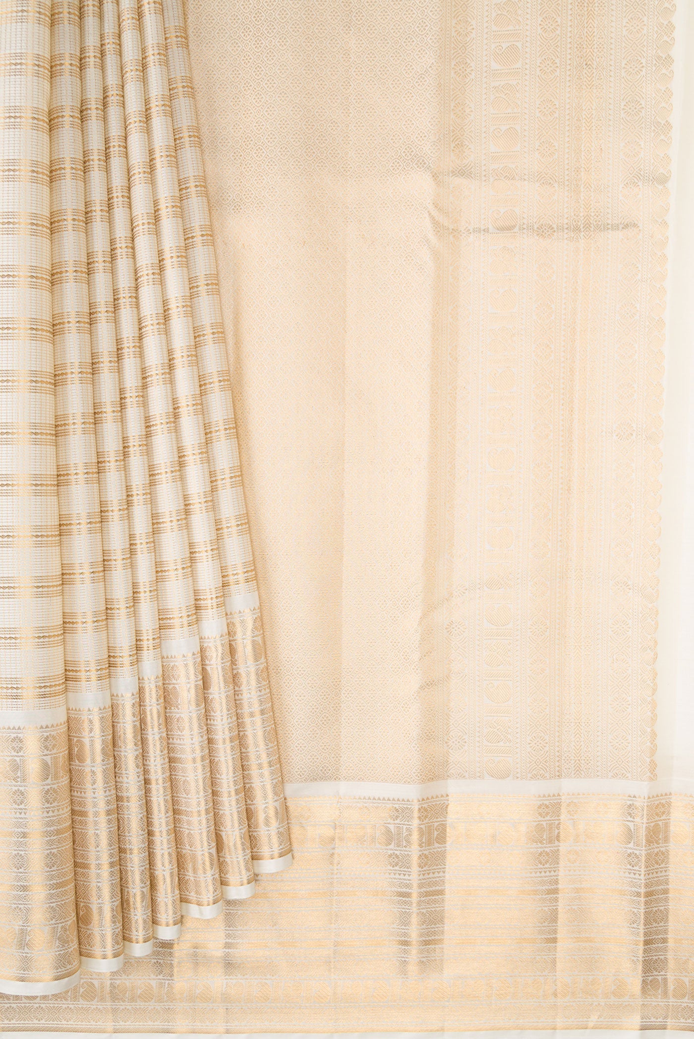 Pleats and pallu of Cream Kanjivaram Silk Saree with Stripes on the body and Zari Border. 