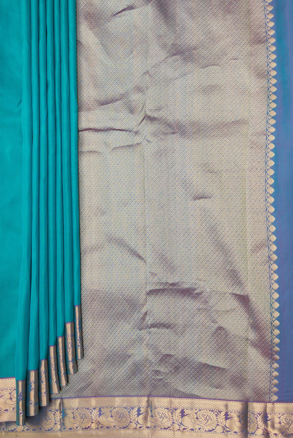 Pleats and pallu of Peacock Blue Kanjivaram Silk Saree with Plain Body and Zari Border. 