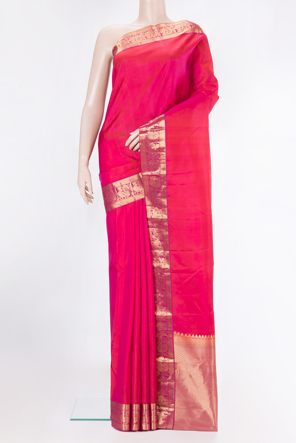 Pure Silk Coral Dual Tone Kanjivaram Saree with Plain Body and Zari Border.  displayed on a mannequin