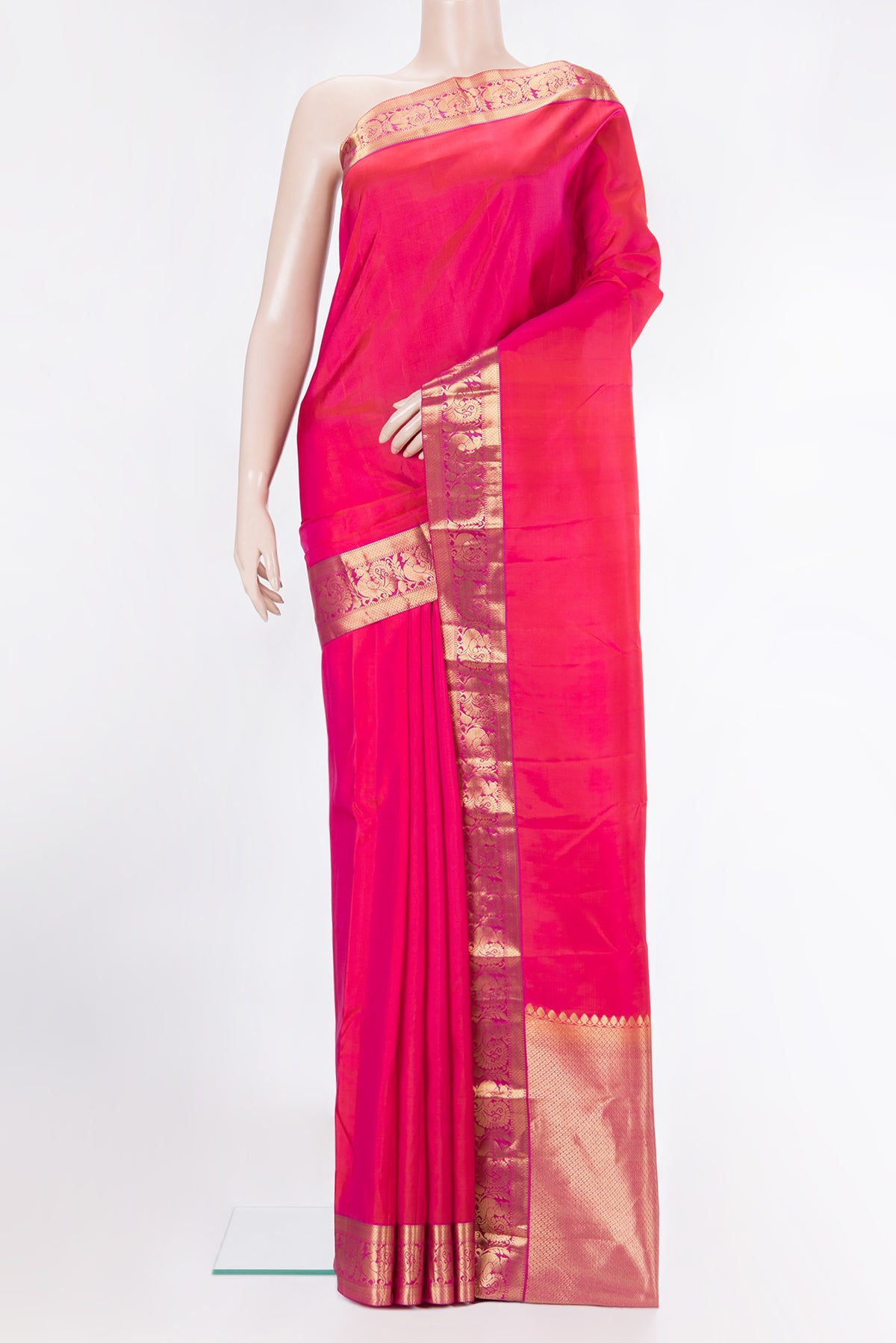 Pure Silk Coral Dual Tone Kanjivaram Saree with Plain Body and Zari Border.  displayed on a mannequin
