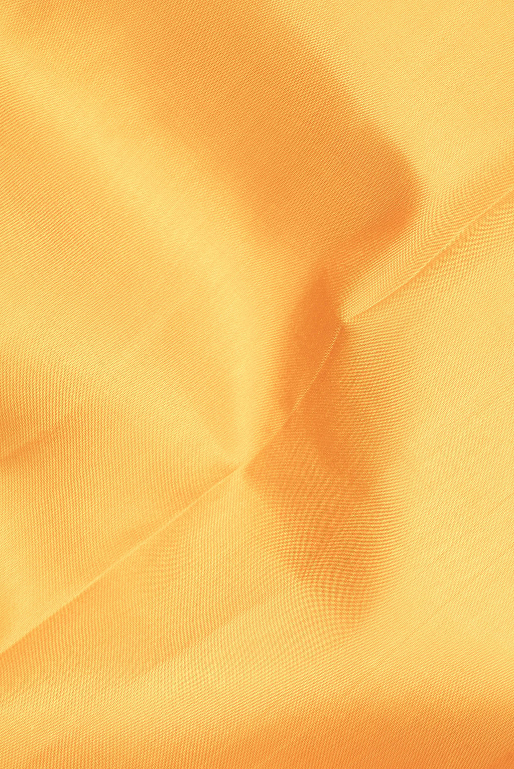 Close up of Pure Silk Yellow Kanjivaram Saree with Plain Body and Zari Border.  displaying folds