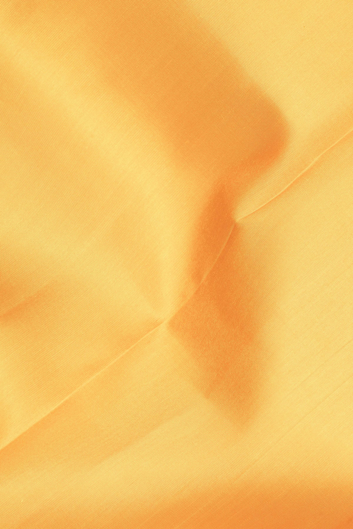 Close up of Pure Silk Yellow Kanjivaram Saree with Plain Body and Zari Border.  displaying folds