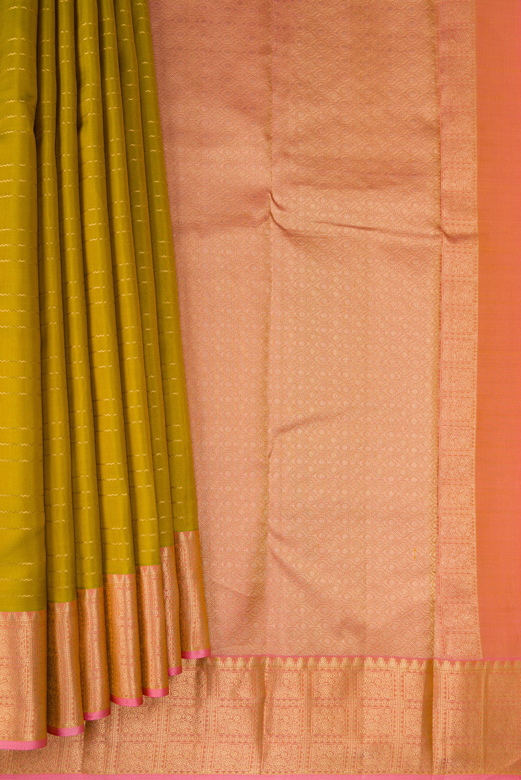 Pleats and pallu of Mehandi Green Kanchipuram Silk Saree with Veldhari on the body and Zari Border. 
