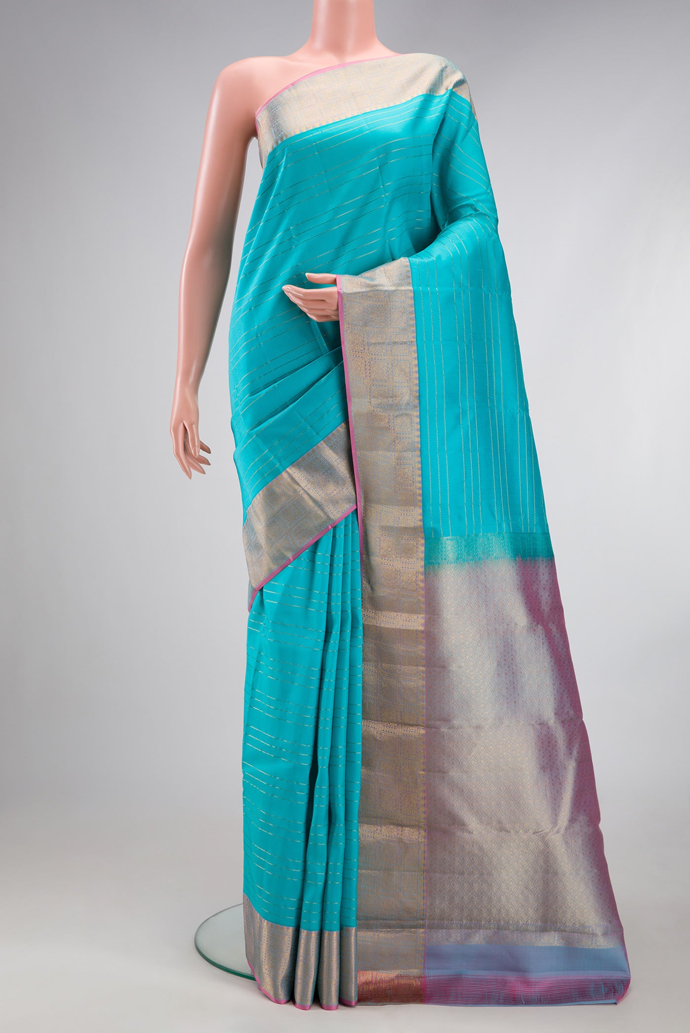 Sky Blue Kanchipuram Silk Saree with Veldhari on the body and Zari Border.  displayed on a mannequin