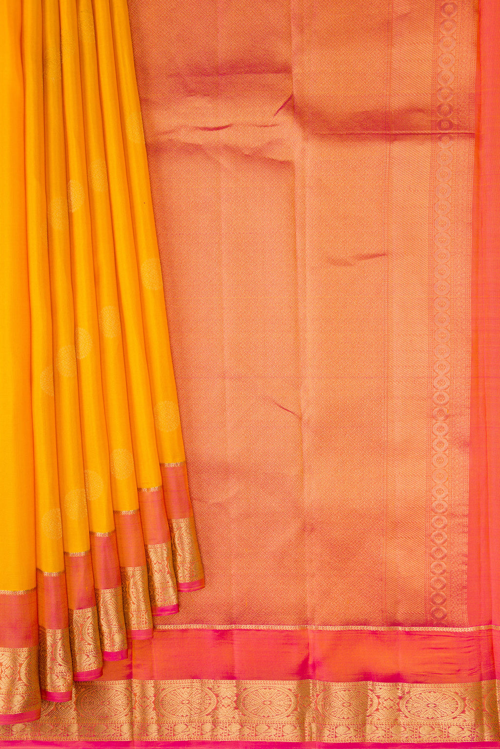 Pleats and pallu of Mustard Dual Tone Kanchipuram Silk Saree with Zari Butta on the body and Zari Border. 