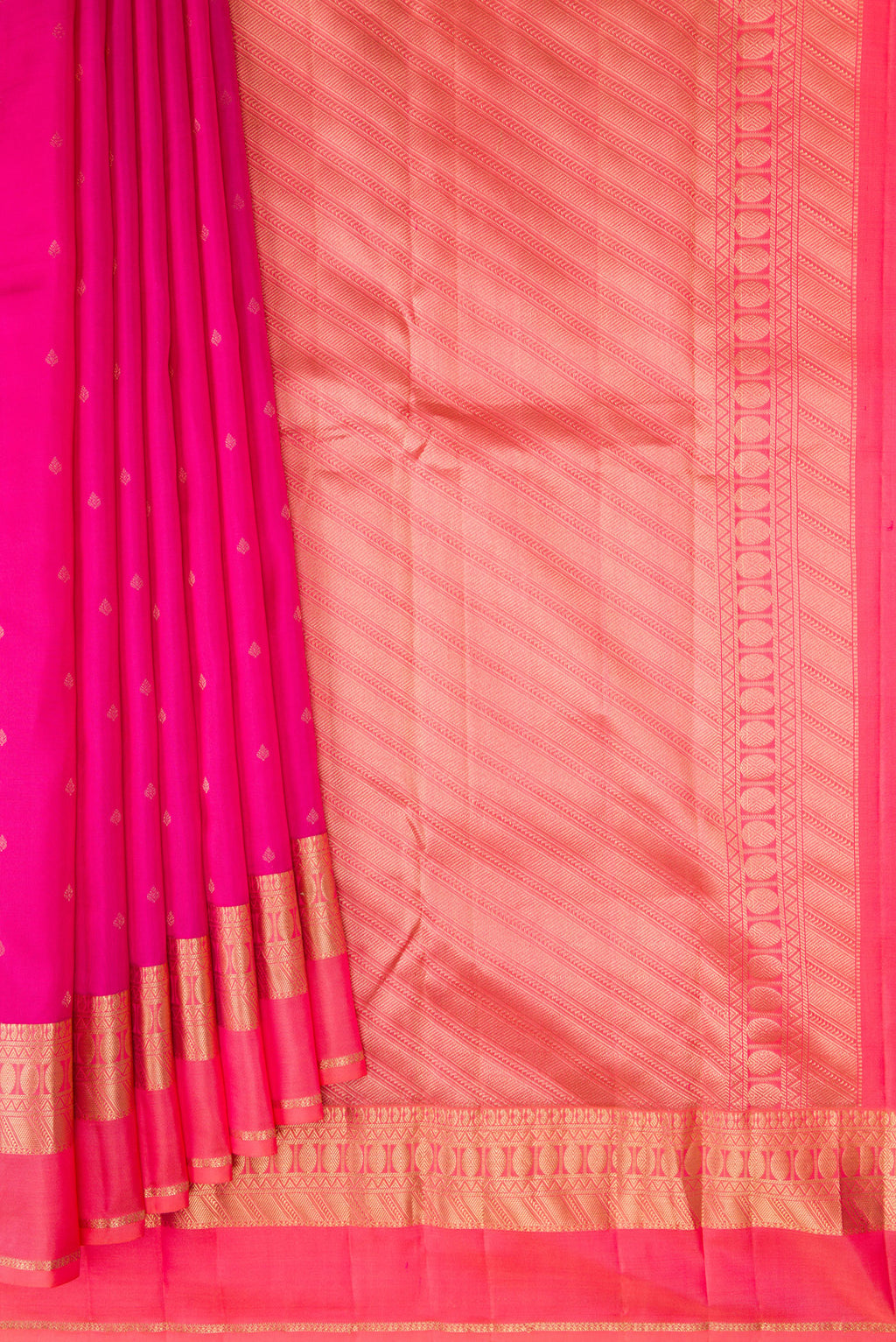Pleats and pallu of Dark Pink Kanchipuram Silk Saree with Zari Butta on the body and Zari Border. 