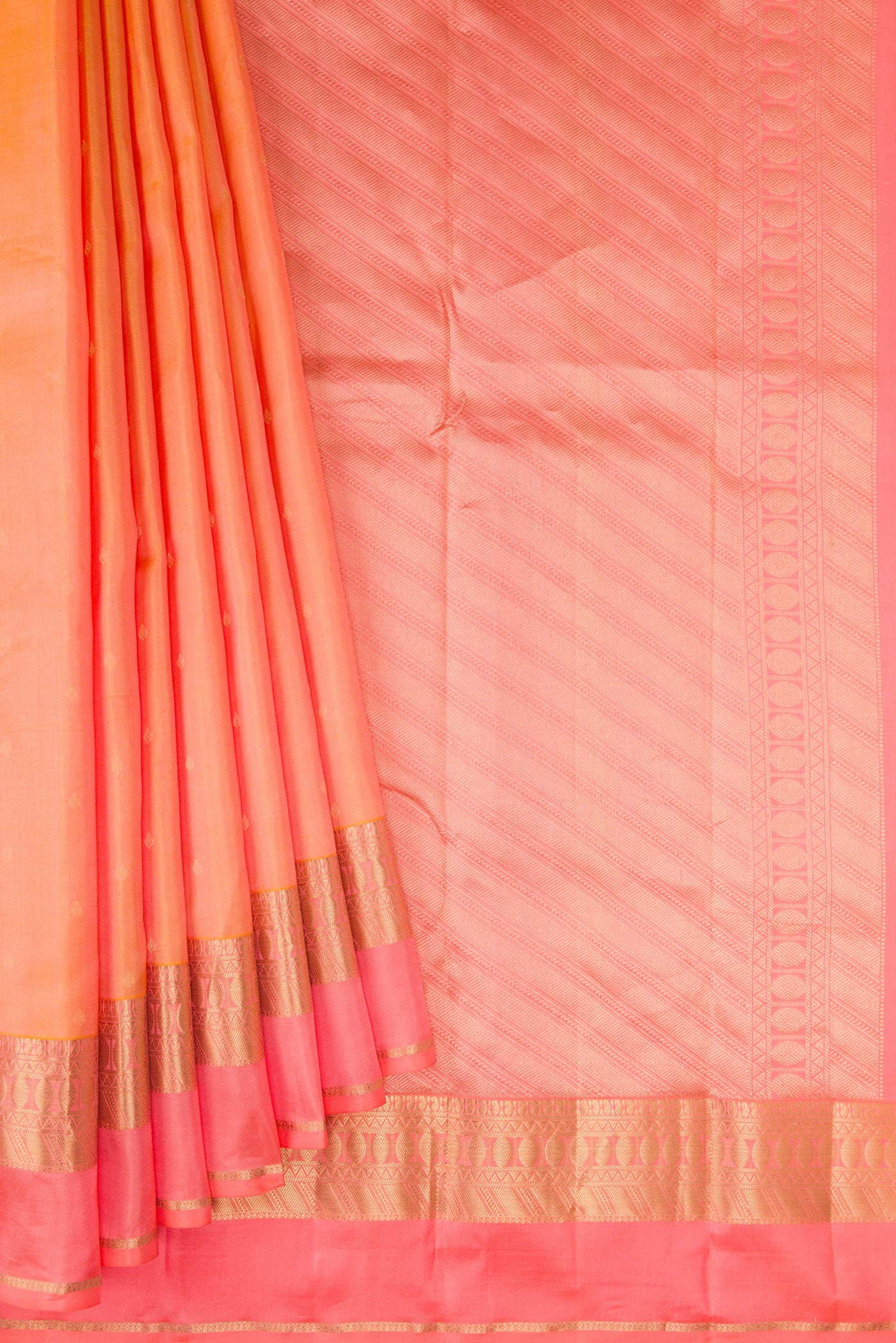 Pleats and pallu of Golden Peach Kanchipuram Silk Saree with Zari Butta on the body and Fancy Border. 