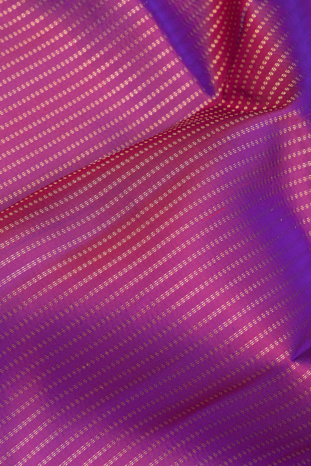 Close up of Pure Silk Purple Kanchipuram Saree with Stripes on the body and Zari Border.  displaying folds