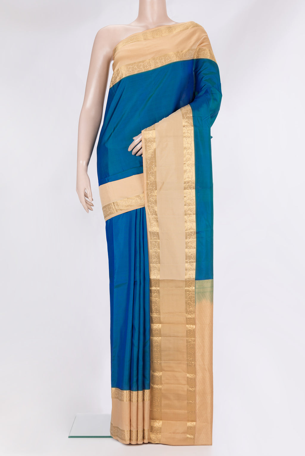 Pure Silk Peacock Blue Kanchipuram Saree with Plain Body and Zari Border.  displayed on a mannequin