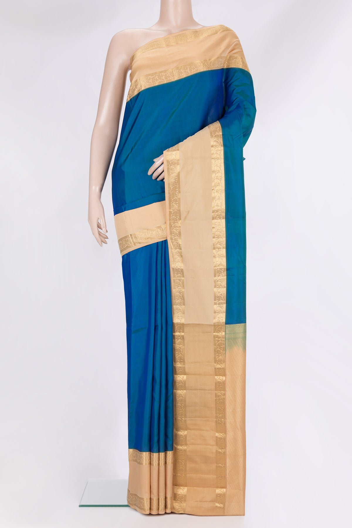 Pure Silk Peacock Blue Kanchipuram Saree with Plain Body and Zari Border.  displayed on a mannequin
