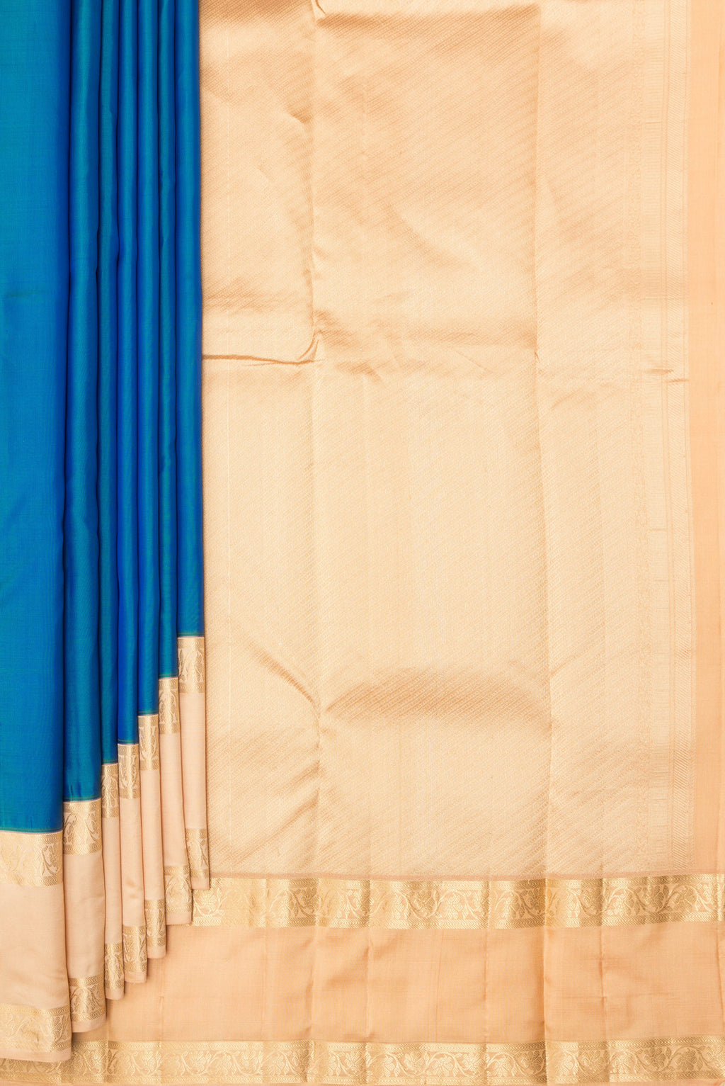Pleats and pallu of Pure Silk Peacock Blue Kanchipuram Saree with Plain Body and Zari Border. 