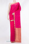 Pure Silk Dark Pink Kanchipuram Saree with Zari Butta on the body and Zari Border.  displayed on a mannequin