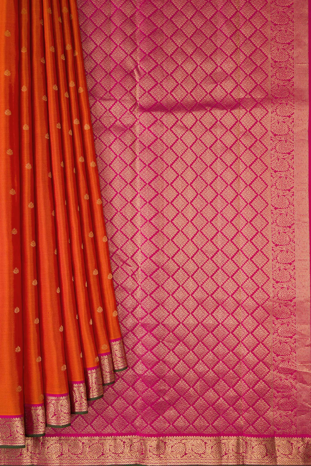 Pleats and pallu of Brick Orange Kanchipuram Silk Saree with Zari Butta on the body and Zari Border. 