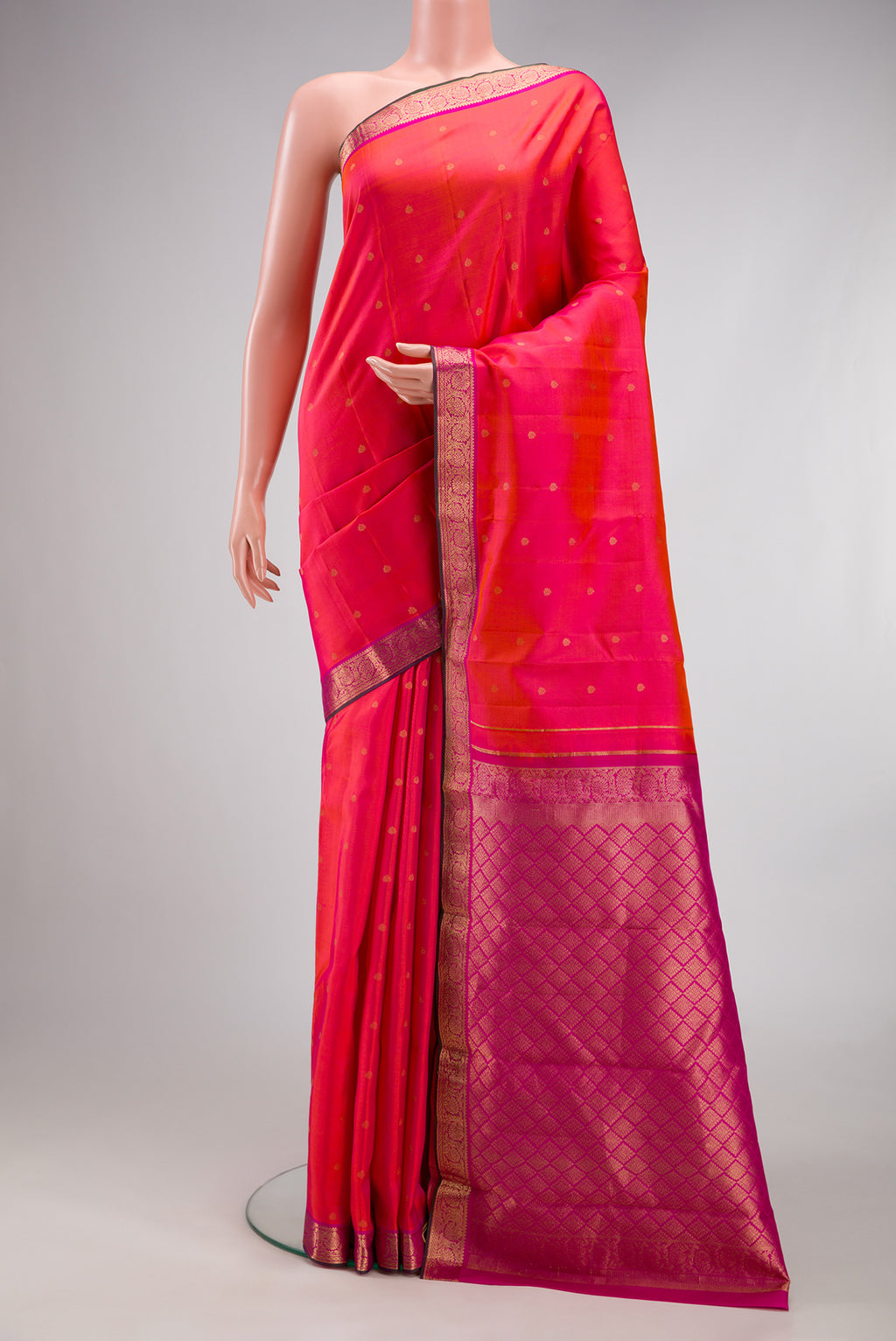 Pink Dual Tone Kanchipuram Silk Saree with Zari Butta on the body and Zari Border.  displayed on a mannequin