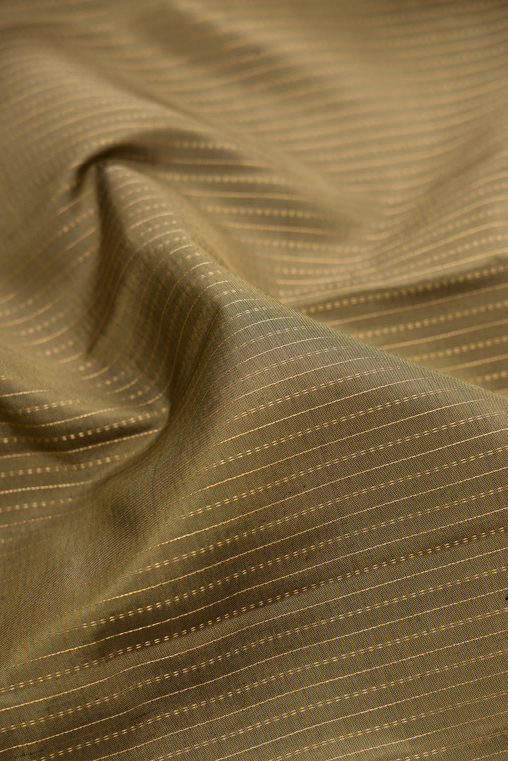 Close up of Mehandi Green Kanjivaram Silk Saree with Stripes on the body and Zari Border.  displaying folds