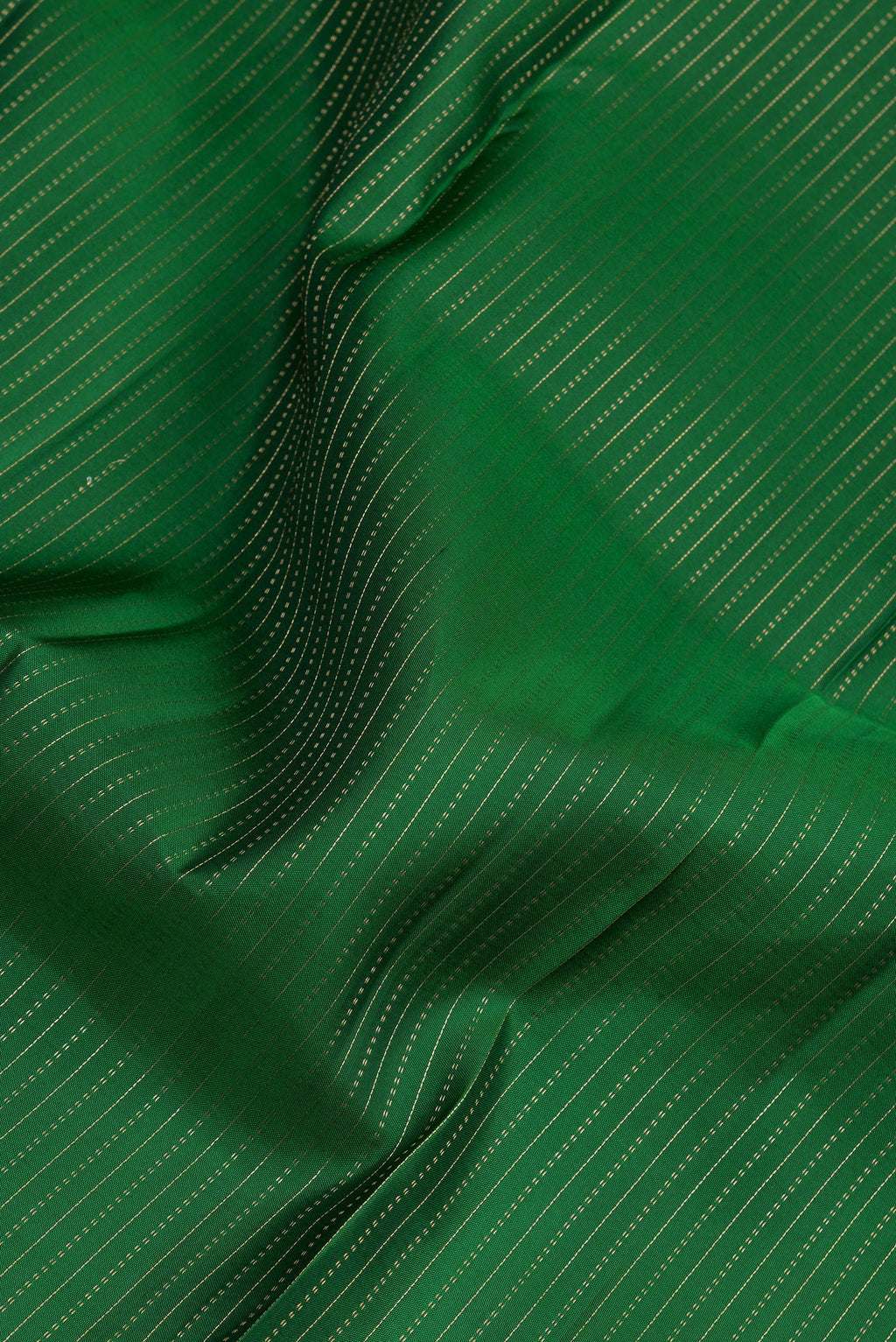 Close up of Bottle Green Kanjivaram Silk Saree with Stripes on the body and Zari Border.  displaying folds