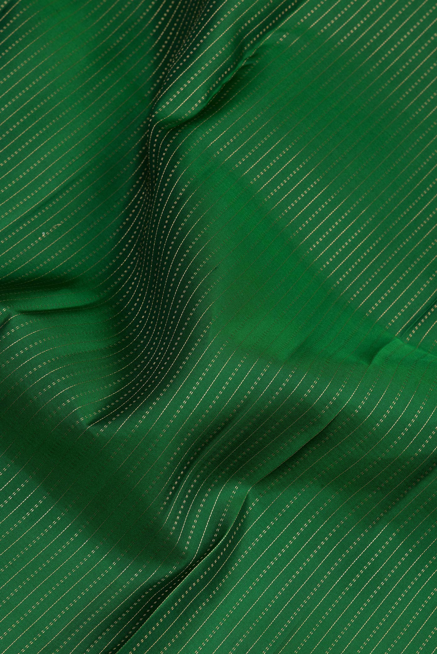 Close up of Bottle Green Kanjivaram Silk Saree with Stripes on the body and Zari Border.  displaying folds