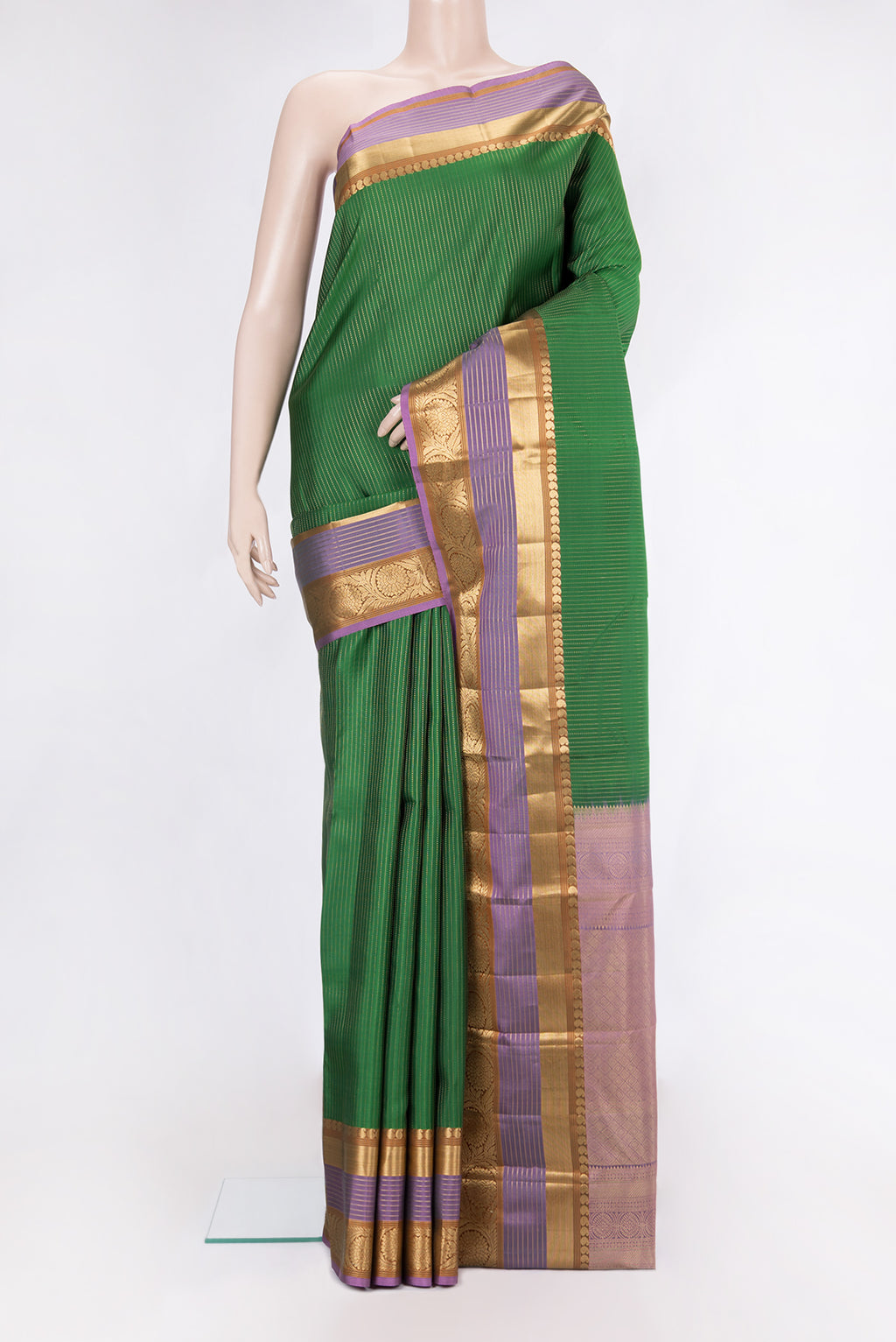 Bottle Green Kanjivaram Silk Saree with Stripes on the body and Zari Border.  displayed on a mannequin