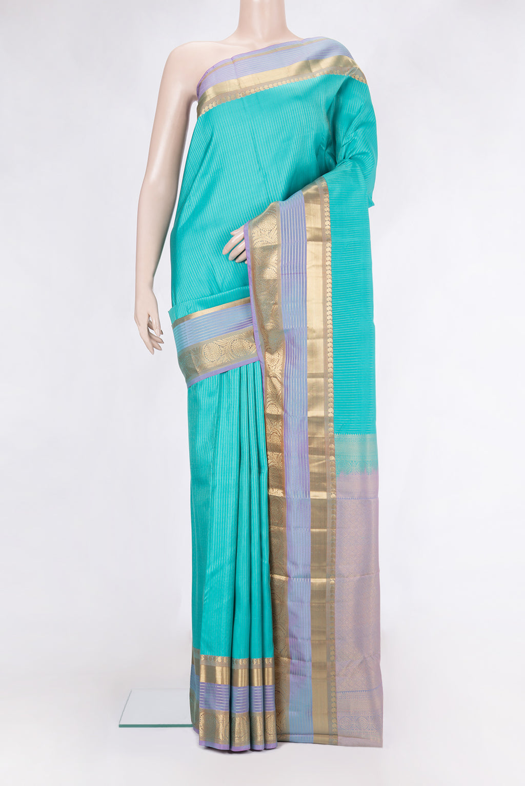 Sky Blue Kanjivaram Silk Saree with Stripes on the body and Zari Border.  displayed on a mannequin