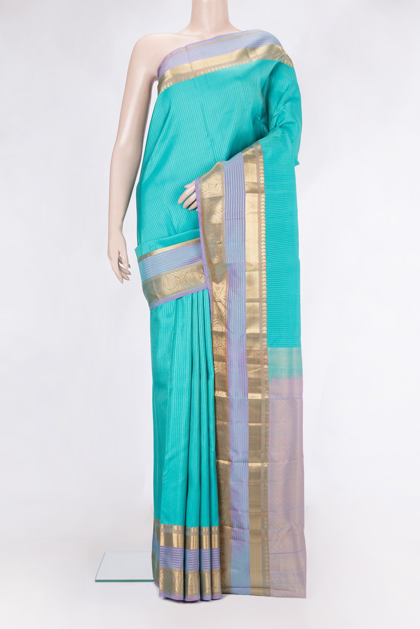 Sky Blue Kanjivaram Silk Saree with Stripes on the body and Zari Border.  displayed on a mannequin