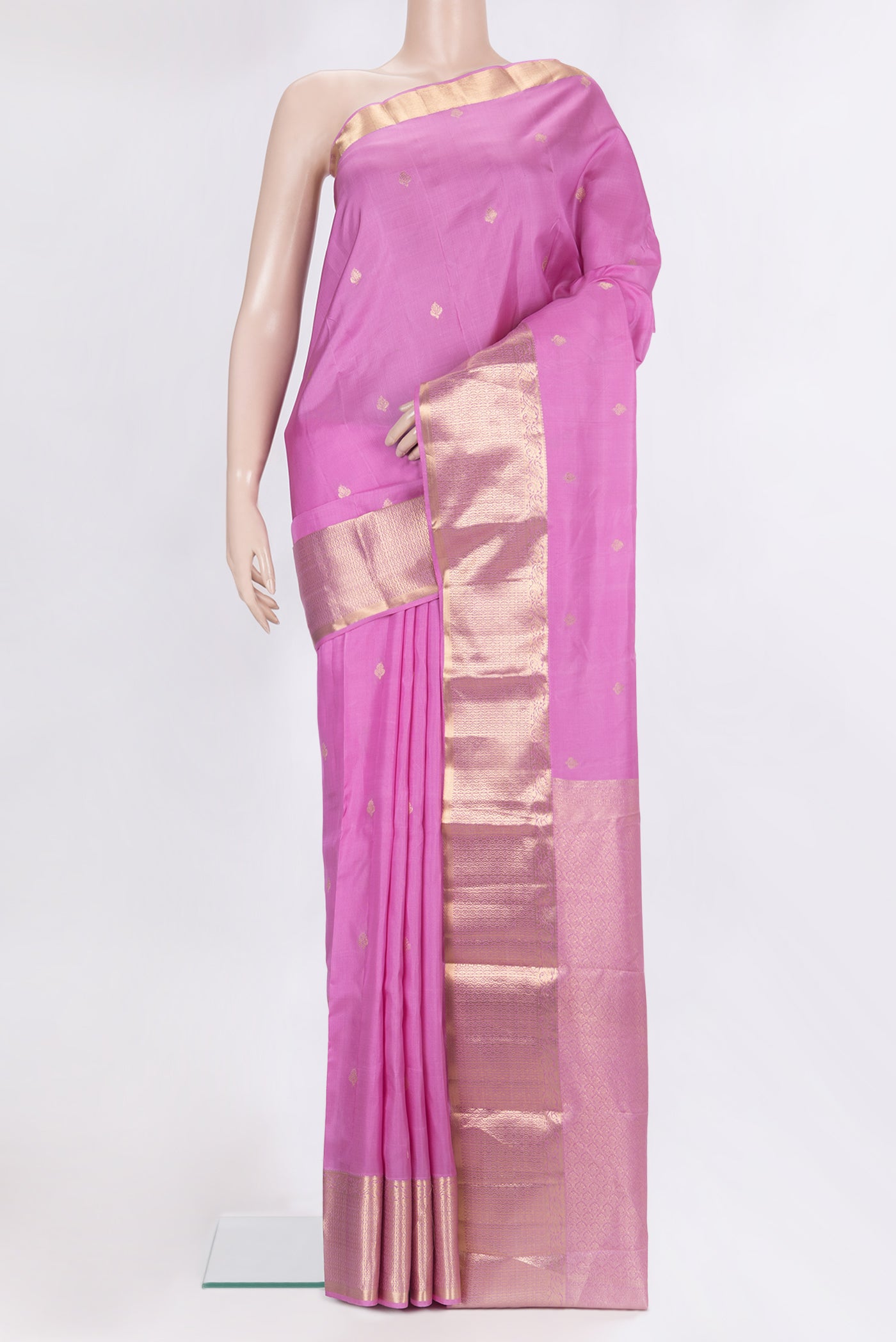 Pure Silk Rose pink Kanchipuram Saree with Zari Butta on the body and Zari Border.  displayed on a mannequin