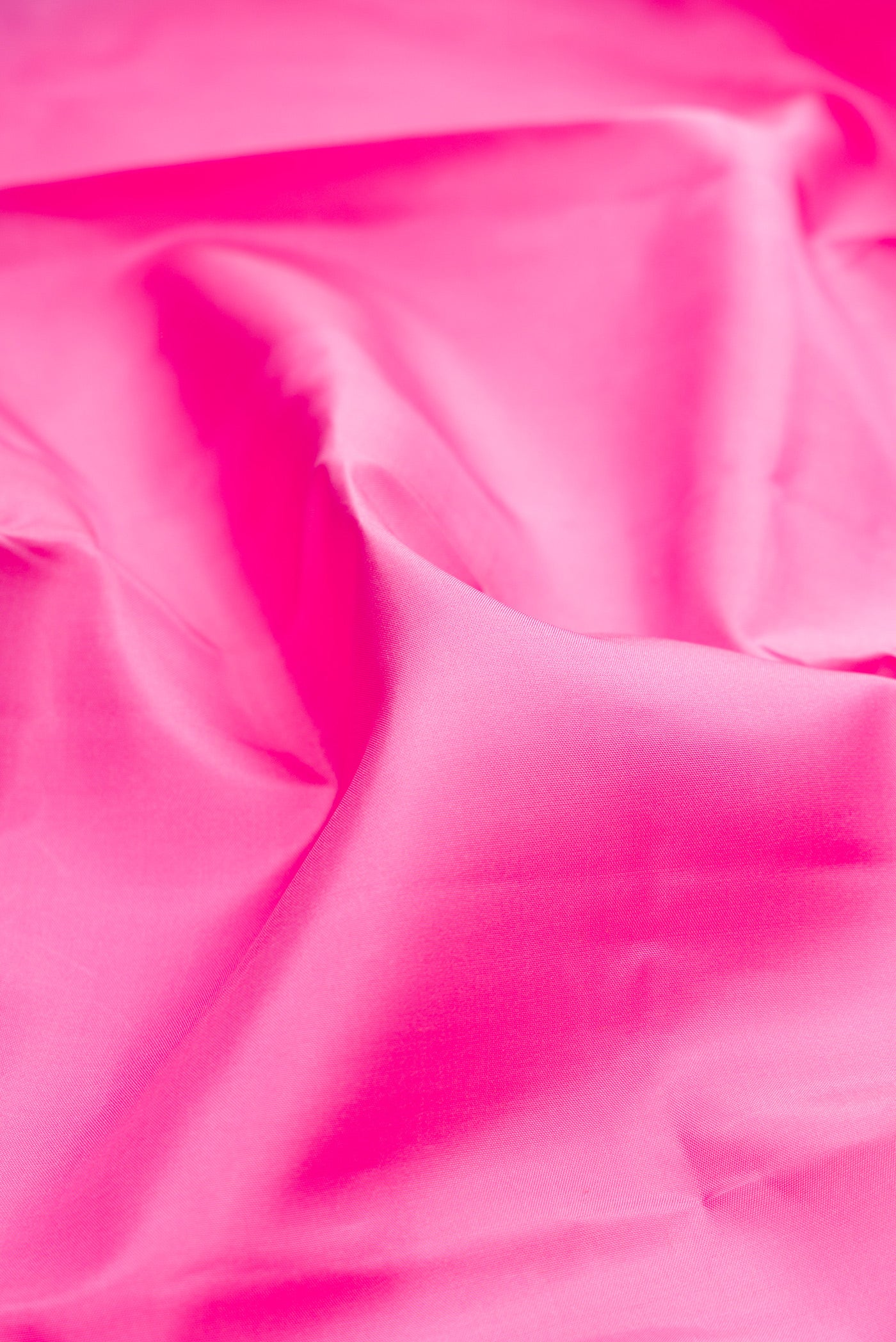 Close up of Rose pink Kanchipuram Silk Saree with Plain Body and Temple Border.  displaying folds