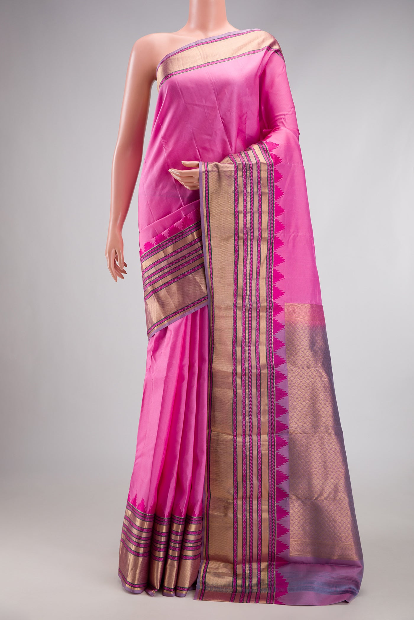 Rose pink Kanchipuram Silk Saree with Plain Body and Temple Border.  displayed on a mannequin