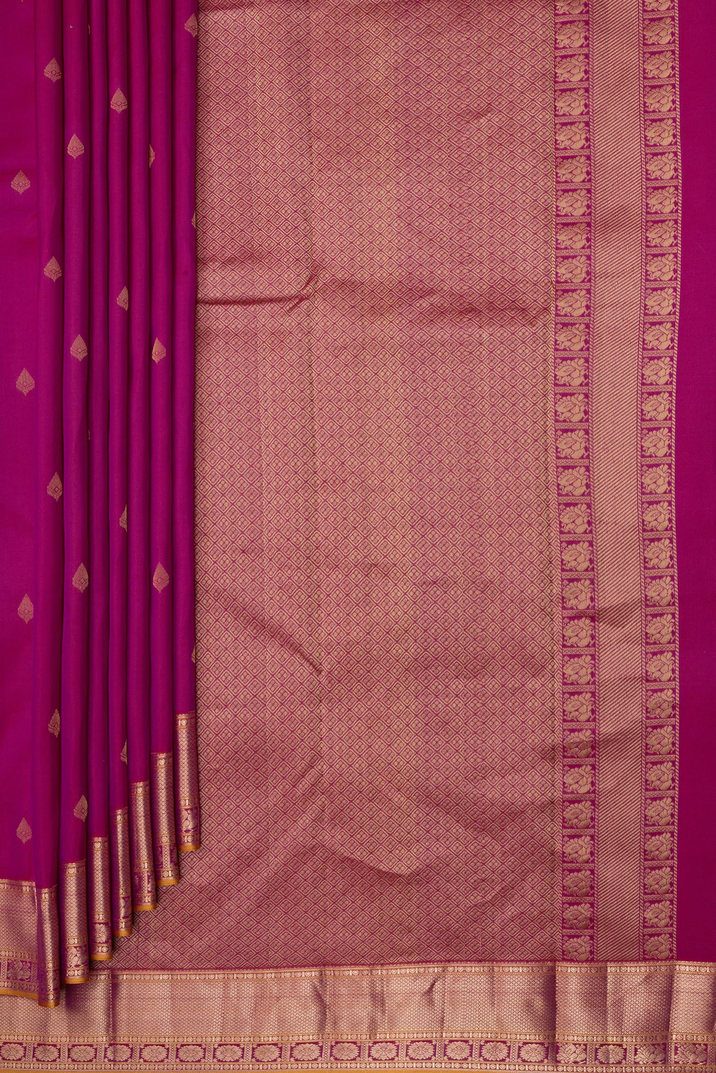 Pleats and pallu of Magenta Kanchipuram Silk Saree with Zari Butta on the body and Zari Border. 