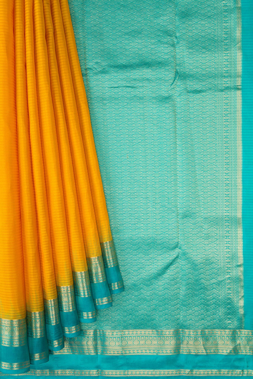 Pleats and pallu of Mustard Kanchipuram Silk Saree with Stripes on the body and Zari Border. 