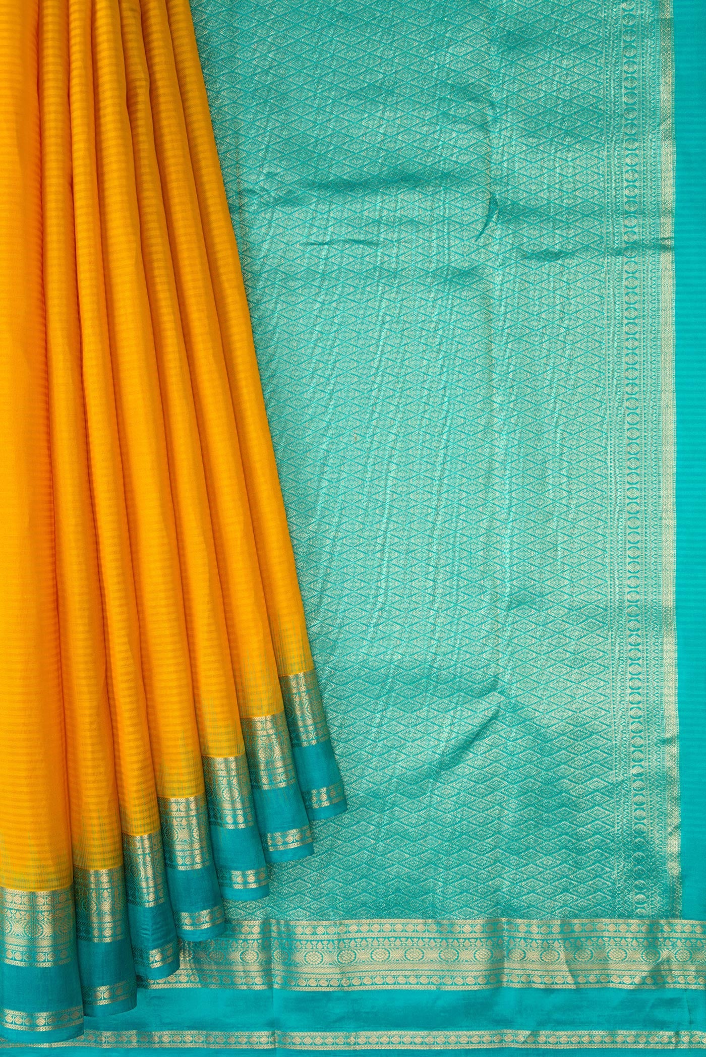 Pleats and pallu of Mustard Kanchipuram Silk Saree with Stripes on the body and Zari Border. 