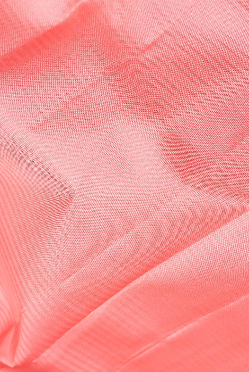 Close up of Pure Silk Peach Kanchipuram Saree with Stripes on the body and Zari Border.  displaying folds
