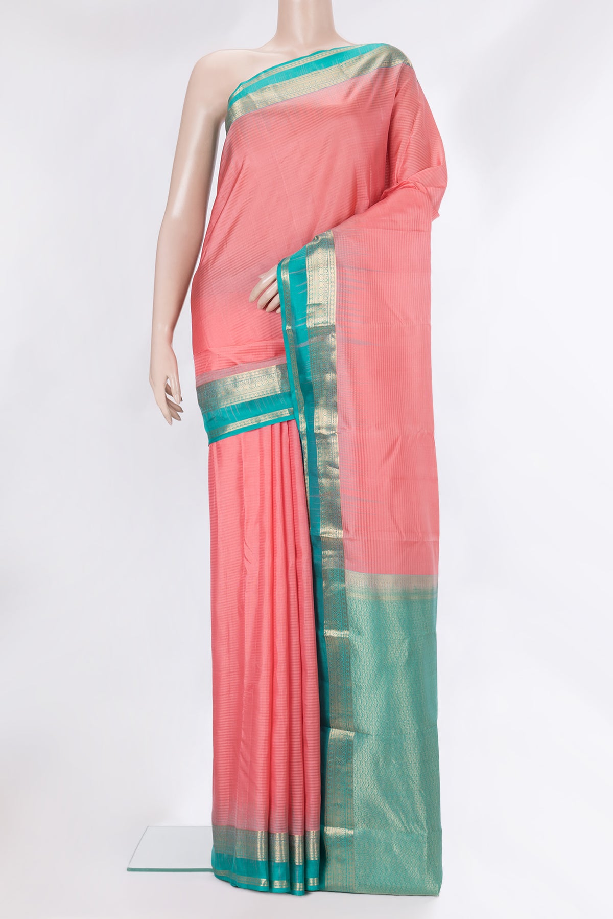 Pure Silk Peach Kanchipuram Saree with Stripes on the body and Zari Border.  displayed on a mannequin