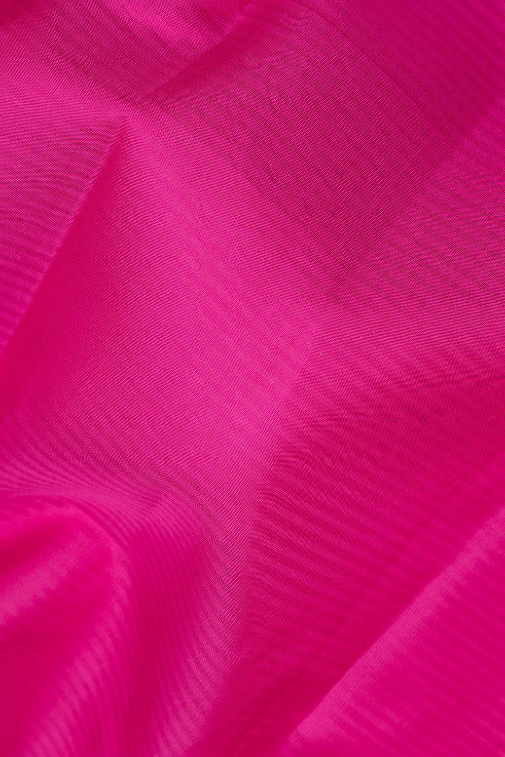 Close up of Pure Silk Pink Kanchipuram Saree with Stripes on the body and Fancy Border.  displaying folds