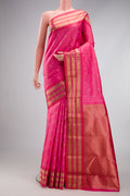Rose pink Kanchipuram Silk Saree with Zari Butta on the body and Zari Border.  displayed on a mannequin