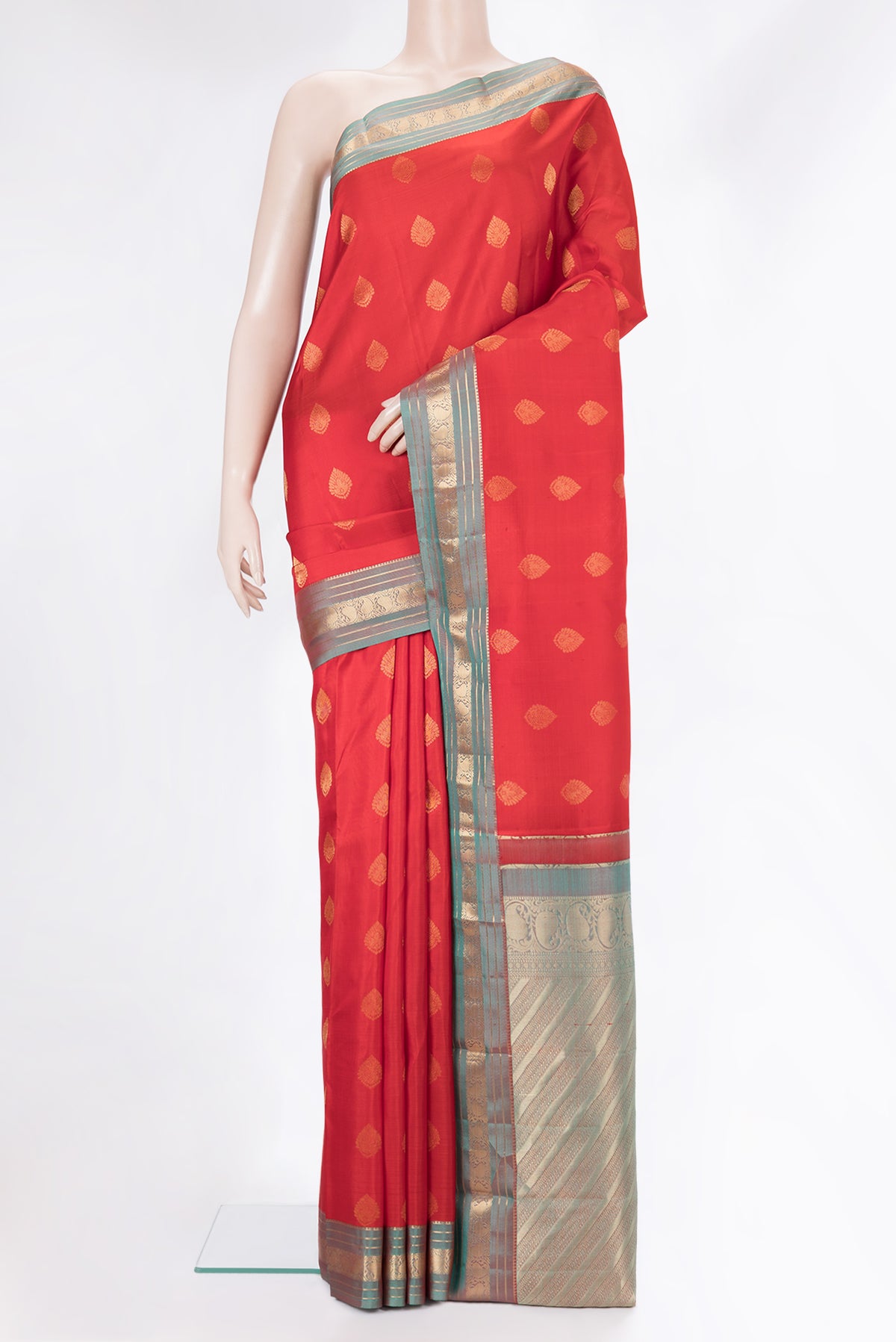 Pure Silk Red Kanchipuram Saree with Zari Butta on the body and Zari Border.  displayed on a mannequin