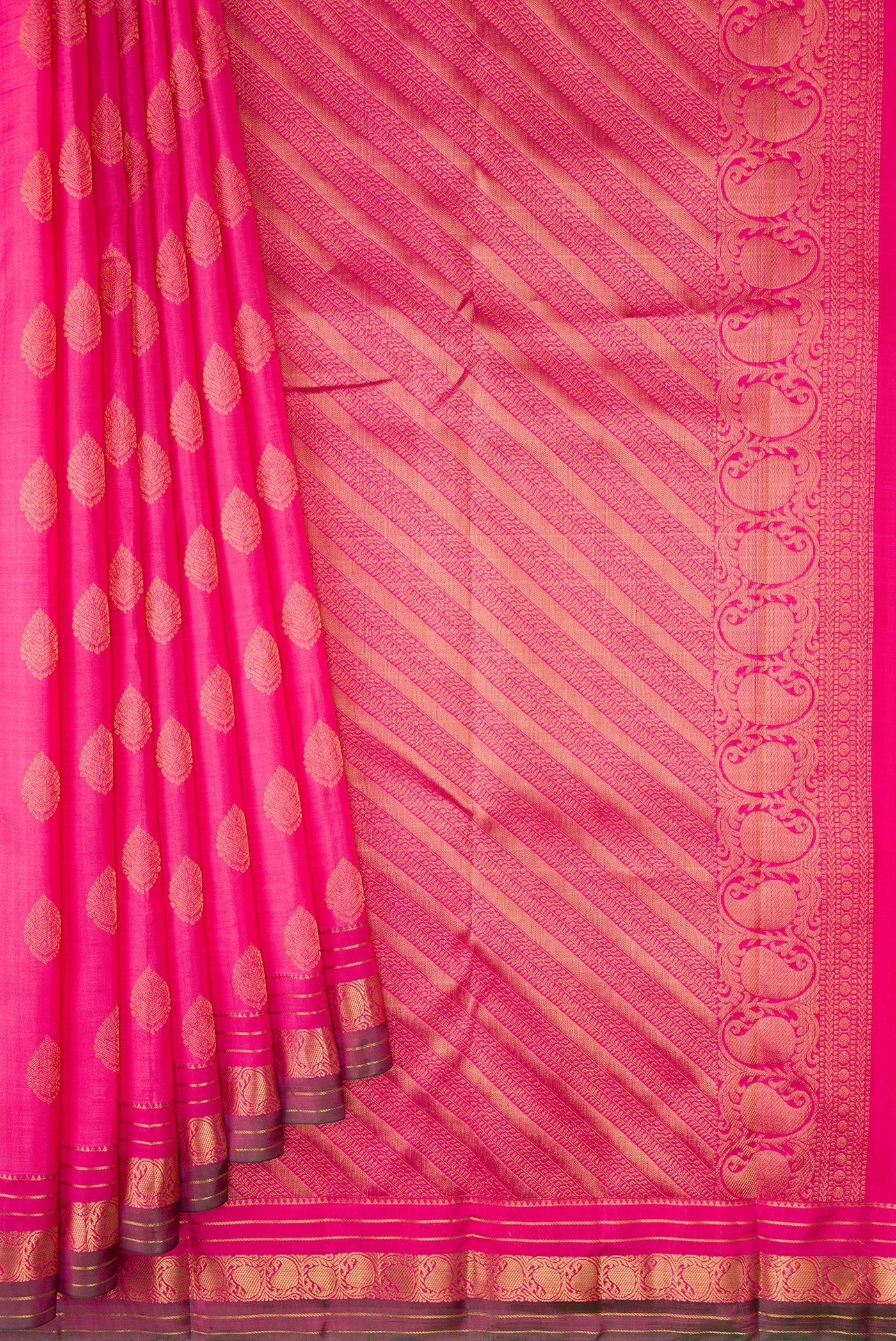 Pleats and pallu of Pink Kanchipuram Silk Saree with Zari Butta on the body and Zari Border. 