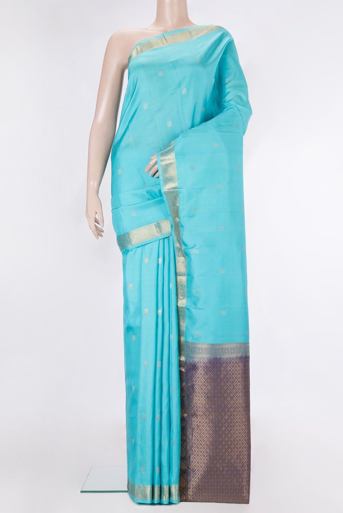 Pure Silk Sky Blue Kanchipuram Saree with Zari Butta on the body and Zari Border.  displayed on a mannequin