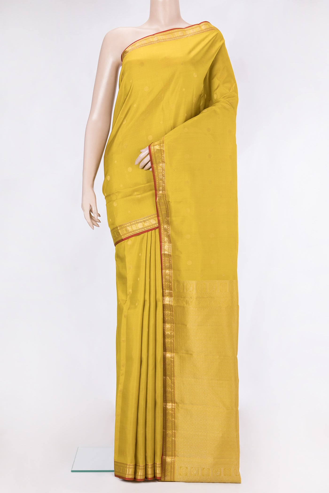 Lemon Yellow Kanchipuram Silk Saree with Zari Butta on the body and Zari Border.  displayed on a mannequin